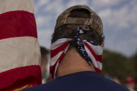 An Israeli supporter of U.S. President Donald Trump for re-election wears a face covering in the colors of the American flag, at a rally in Jerusalem, Tuesday, Oct. 27, 2020. (AP Photo/Maya Alleruzzo)