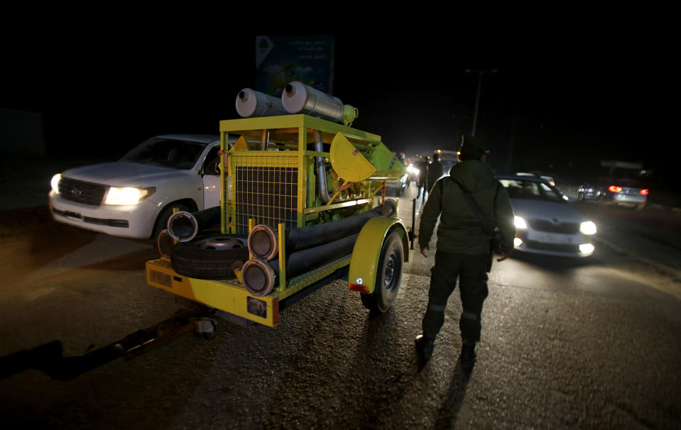 Rescue vehicles, part of a convoy of around 20, arrives in Gaza City, Tuesday, Dec. 17, 2019. Palestinian officials say Israel has allowed the import of around 20 rescue and firefighting vehicles. The equipment was donated by Qatar. (AP Photo/Hatem Moussa)