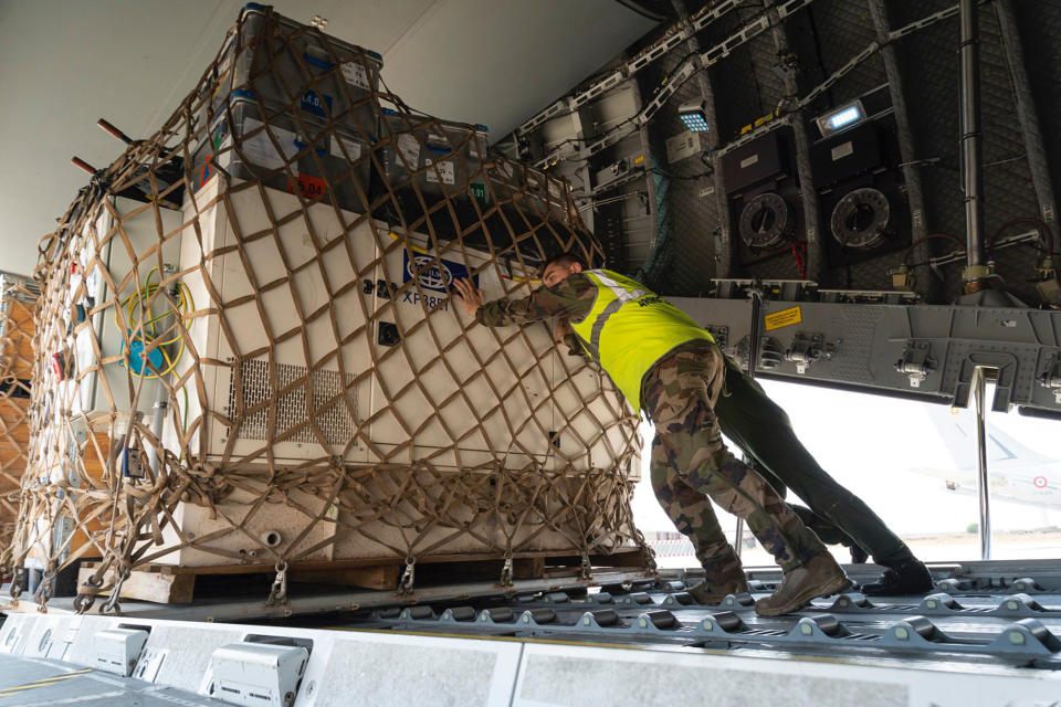 In this photo provided bye the French Army, soldiers load a cargo plane with disaster relief for Libya, Wednesday, Sept. 13, 2023 at the Istres military base, southern France. A Libyan local health official said the toll in Libya has reached more than 5,100 dead and is expected to rise further in the eastern city of Derna where floods caused massive devastation over the weekend. French government' s spokesman said a French rescue team of about 50 people aim at being "operational within 48 hours" in Libya. (État-Major des Armees via AP)