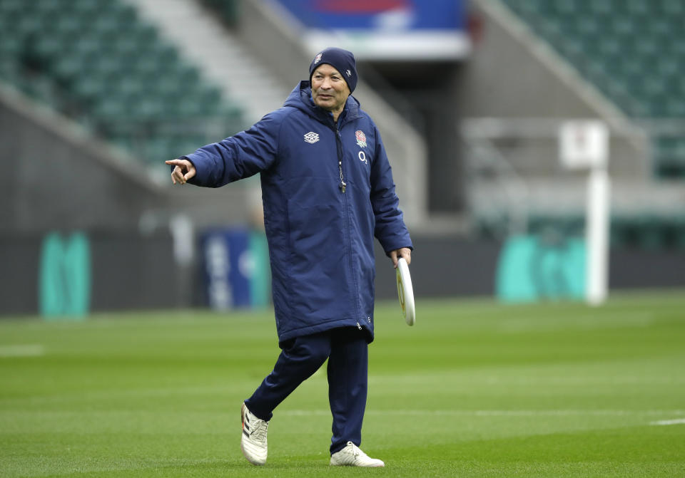 England coach Eddie Jones gestures holding a frisbee during an England rugby team training session at Twickenham in London, Saturday, Oct.17, 2020. England are preparing for a series of matches including the finish of the Six Nations championship which was interrupted earlier in the year because of the coronavirus outbreak. (AP Photo/Matt Dunham, Pool)