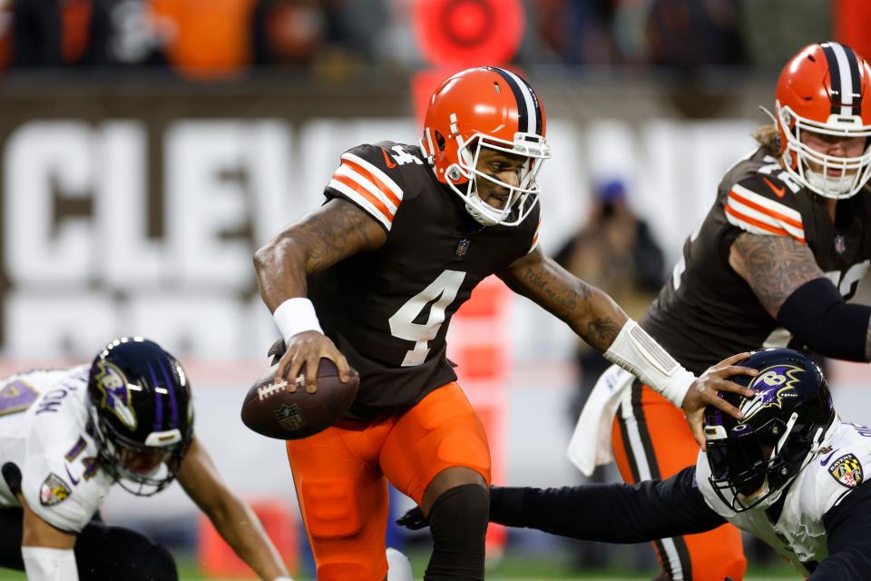 Browns quarterback Deshaun Watson carries the ball during the first half against the Ravens, Saturday, Dec. 17, 2022, in Cleveland.