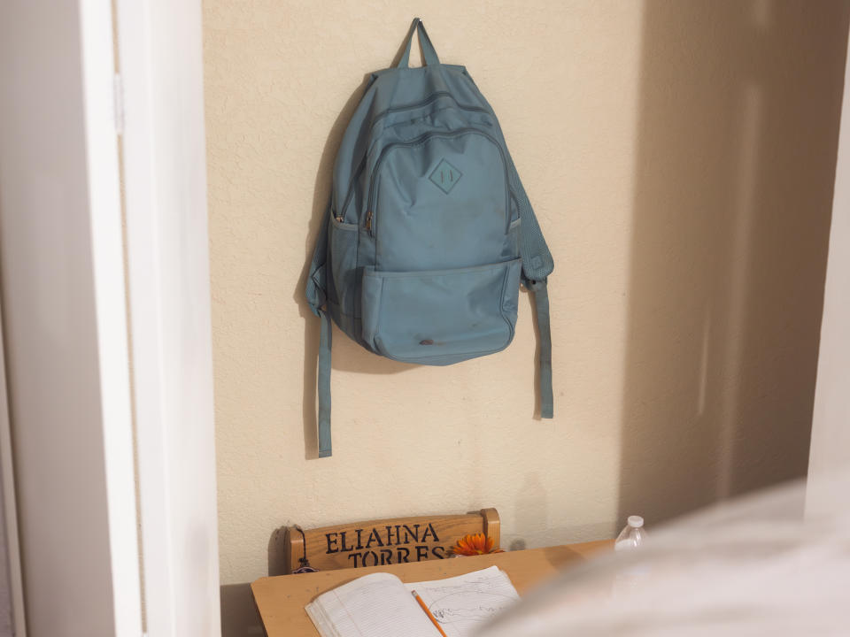 The small blue backpack Eliahna Torres wore the day she was killed, hanging in a closet in a room dedicated to her, on April 26, 2023 in Uvalde, Texas. (Jordan Vonderhaar for NBC News)