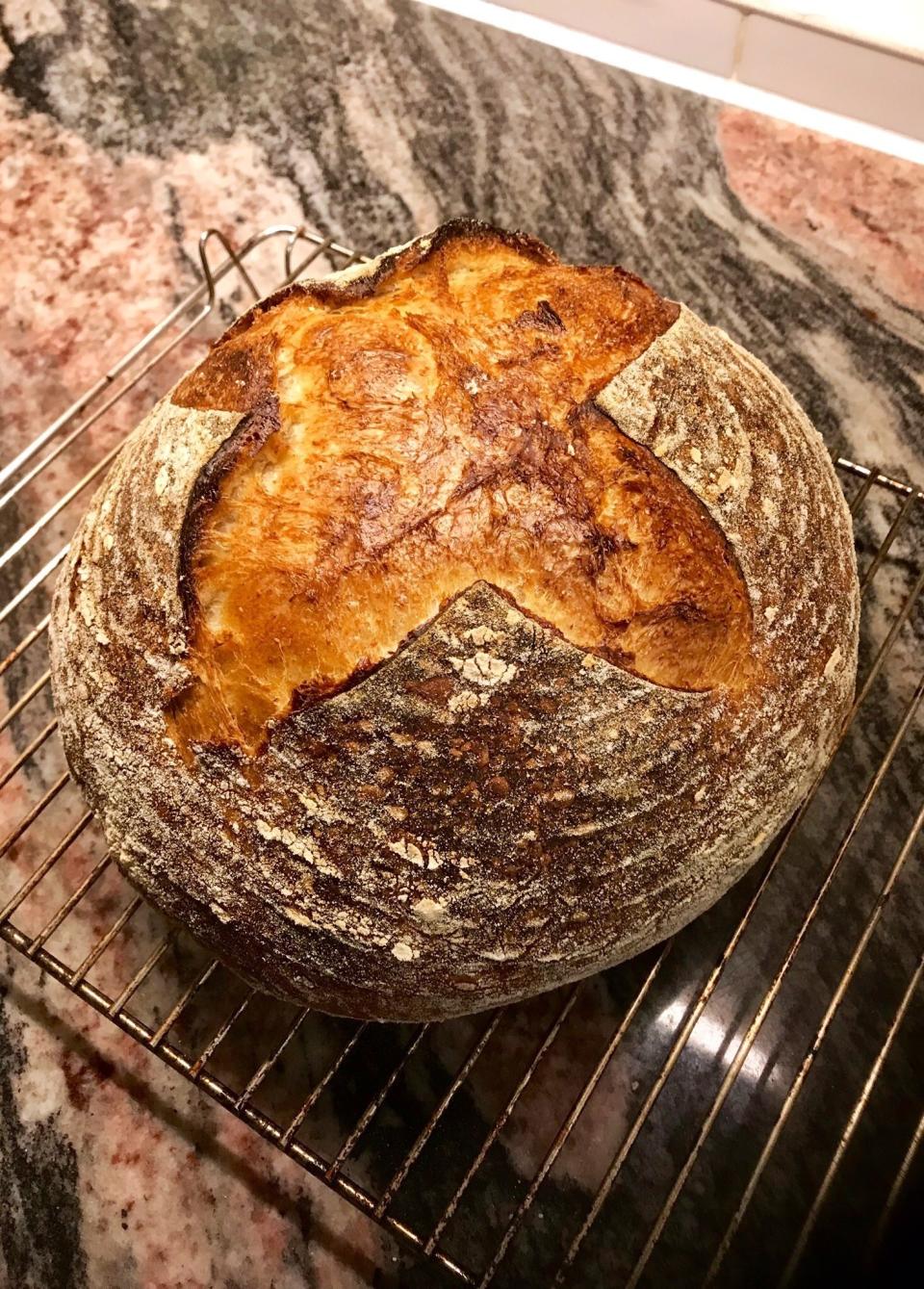 A freshly-baked loaf of sourdough bread appears at a home in London. A freshly-baked loaf of sourdough bread appears at a home in London. With millions of people across the globe working at home due to lockdown measures imposed during the coronavirus pandemic, many people are choosing to make their own bread, rather than venturing to the local store to buy their weekly fix. (Matt Kemp via AP)(Matt Kemp via AP)