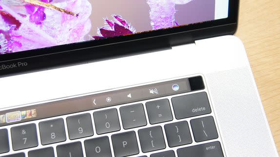 That little black block at the end of the Touch Bar is the touch ID/power button.