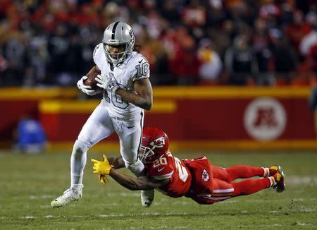 Dec 8, 2016; Kansas City, MO, USA; Oakland Raiders wide receiver Seth Roberts (10) escapes the tackle of Kansas City Chiefs cornerback Steven Nelson (20) during the second half at Arrowhead Stadium. The Chiefs won 21-13. Mandatory Credit: Jay Biggerstaff-USA TODAY Sports