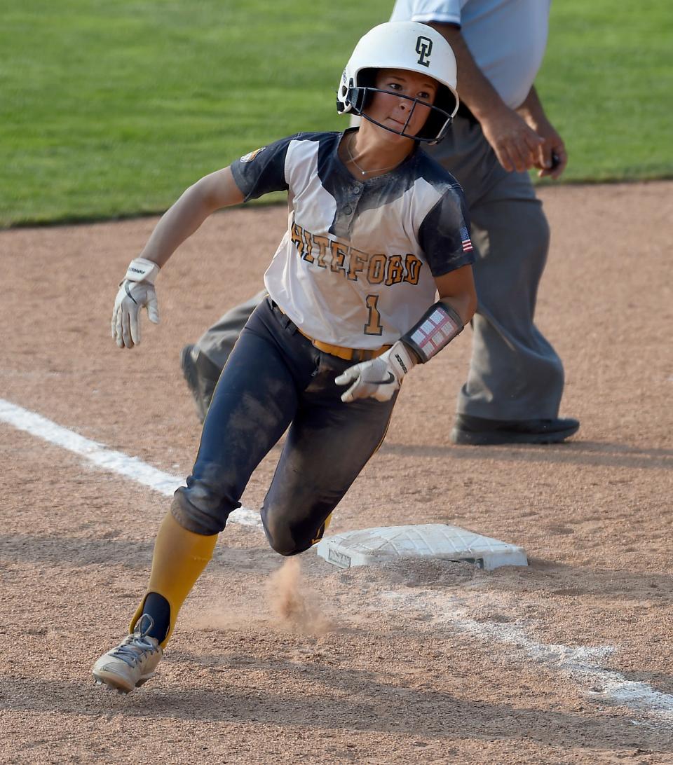 Shaylin Alexander arounds third base to score in the sixth inning after she beat out an infield hit sliding into first base. The Bobcats beat Laingsburg 8-0 in the Division 3 state semifinals at Seehia Stadium, MSU Friday, June 16, 2023.