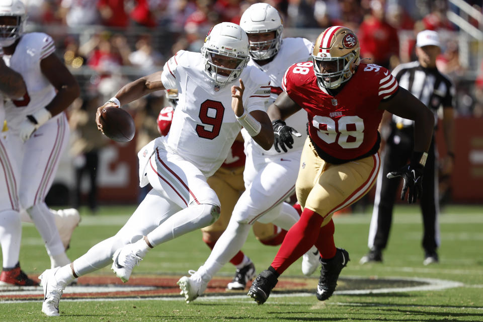 Arizona Cardinals quarterback Joshua Dobbs (9) runs against San Francisco 49ers defensive tackle Javon Hargrave (98) during the first half of an NFL football game in Santa Clara, Calif., Sunday, Oct. 1, 2023. (AP Photo/Josie Lepe)