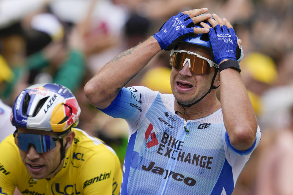 Stage winner Netherlands' Dylan Groenewegen crosses the finish line ahead of second placed Belgium's Wout Van Aert during the third stage of the Tour de France cycling race over 182 kilometers (113 miles) with start in Vejle and finish in Sonderborg, Denmark, Sunday, July 3, 2022. (AP Photo/Daniel Cole)