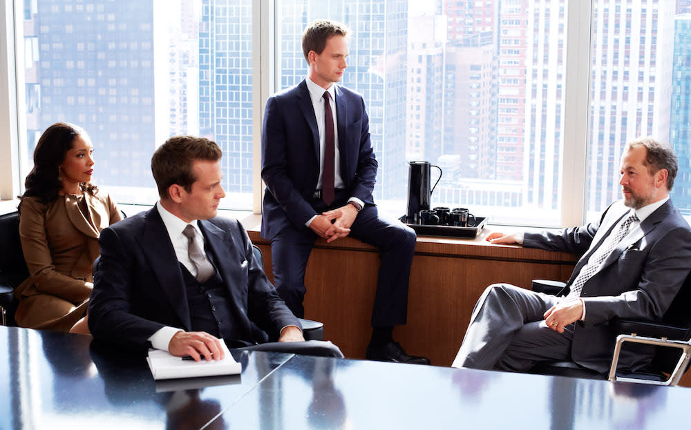 SUITS, l-r: Gina Torres, Gabriel Macht, Patrick J. Adams, David Costabile in 'He's Back' (Season 2, Episode 14, aired February 7, 2013), 2011-, ph: Shane Mahood/©USA Network/courtesy Everett Collection