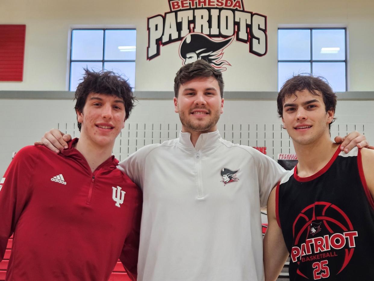 Bethesda Christian seniors Isaac (left) and Sam (right) with assistant coach and brother Jake Mlagan.
