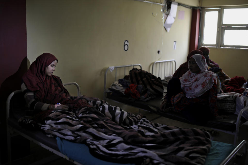 In this Friday, Feb. 28, 2020 photo, Shabana Parveen, who delivered a baby boy on Tuesday after she was rescued by her Hindu neighbors when a Hindu mob attacked her house, rests at Al-Hind hospital in Old Mustafabad neighborhood of New Delhi, India. The hospital in the riot-torn neighborhood turned from a community clinic into a trauma ward, its doctors, for the first time, dealing with injuries like gunshot wounds, crushed skulls and torn male genitals. Authorities haven't said what sparked the violence that has left more than 40 dead and hundreds injured, but it was the culmination of growing tensions since the passage of a citizenship law in December that fast-tracks naturalization for some religious minorities from neighboring countries but not Muslims. (AP Photo/Altaf Qadri)