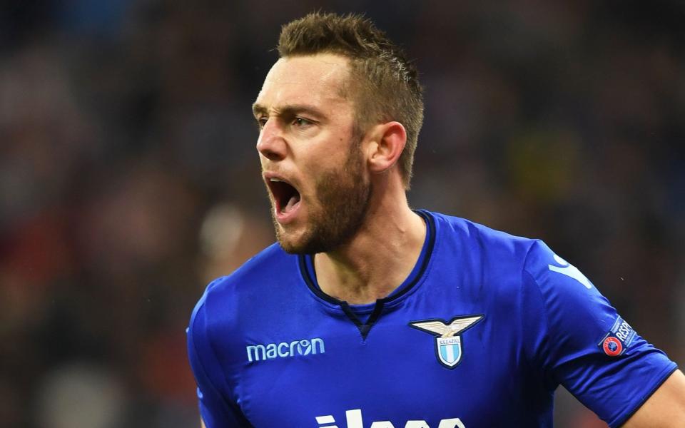 Lazios Stefan de Vrij celebrates his scoring during UEFA Europa League round 16 second-leg football match FC Dynamo Kiev vs SS Lazio Rome at the Olympiyski Stadium in Kiev on March 15, 2018