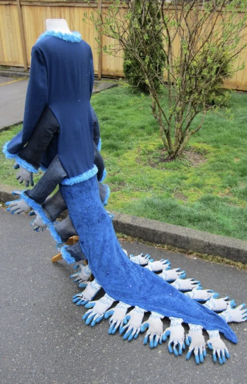 long tail coat with gloves attached to the ends