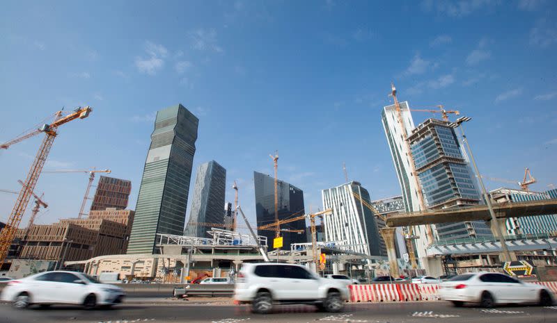 FILE PHOTO: Cars drive past the King Abdullah Financial District in Riyadh