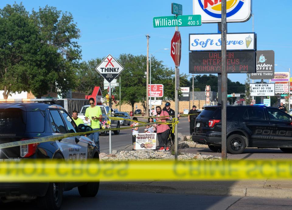 Civilians inside the Burger King on 12th Street are released by law enforcement after shots were fired outside the building on Tuesday, August 9, 2022, in Sioux Falls.