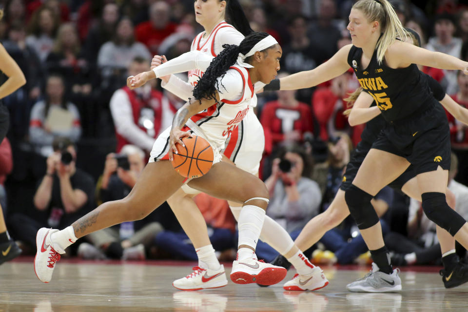 Ohio State forward Cotie McMahon, left, dribbles inside as Iowa forward Monika Czinano, right, defends during second-half action of an NCAA college basketball game at Value City Arena in Columbus, Ohio, Monday, Jan. 23, 2023. (AP Photo/Joe Maiorana)