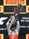 McLaren Mercedes driver Lewis Hamilton of Britain holds up the trophy after winning the Canadian Formula One Grand Prix on June 10, 2012 at the Circuit Gilles Villeneuve in Montreal. AFP PHOTO/Stan HONDASTAN HONDA/AFP/GettyImages