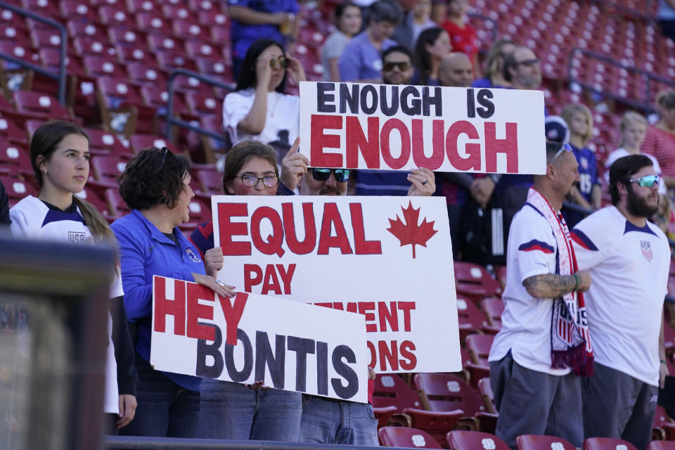 Canada supporters hold up signs during the national anthem before a SheBelieves Cup soccer match against Japan Wednesday, Feb. 22, 2023, in Frisco, Texas. (AP Photo/LM Otero)