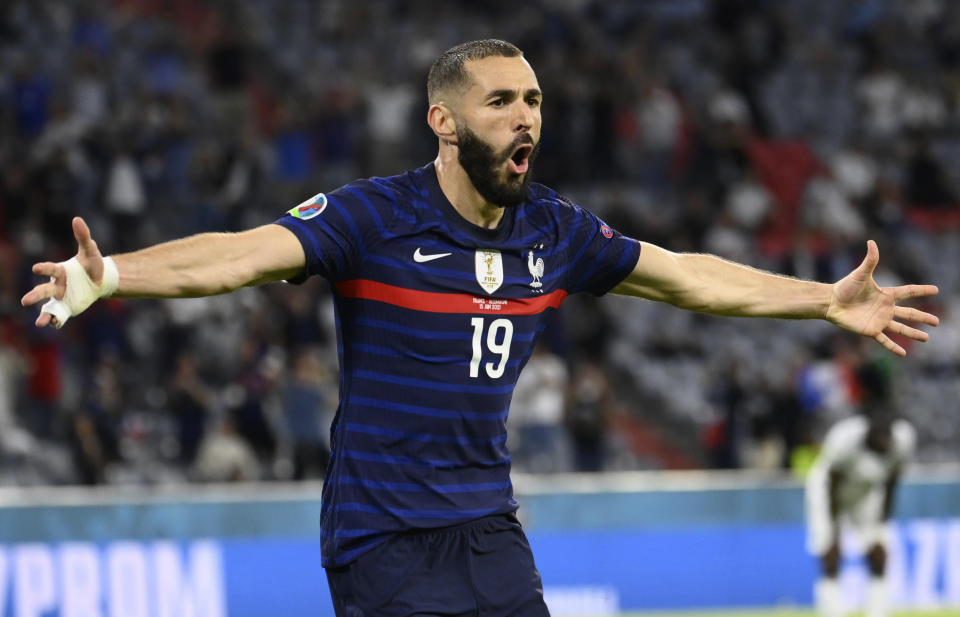 France's Karim Benzema runs to celebrate scoring a goal that was overturned for an offside during the Euro 2020 soccer championship group F match between Germany and France at the Allianz Arena stadium in Munich, Tuesday, June 15, 2021. (Franck Fife/Pool via AP)