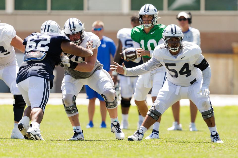 Former Utah lineman Paul Maile (No. 54) in action earlier this month at the Cougars’ practice facility in Provo. | BYU Photo