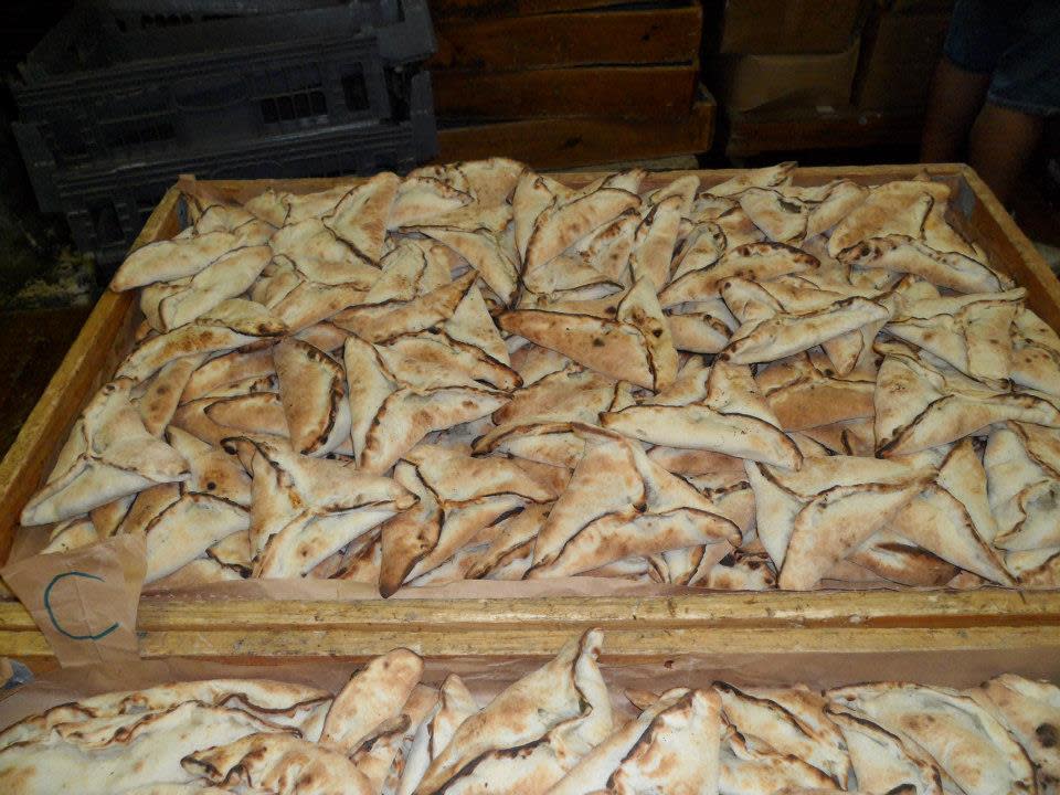 Trays of Lebanese meat pies for sale at Sam's Bakery in Fall River.