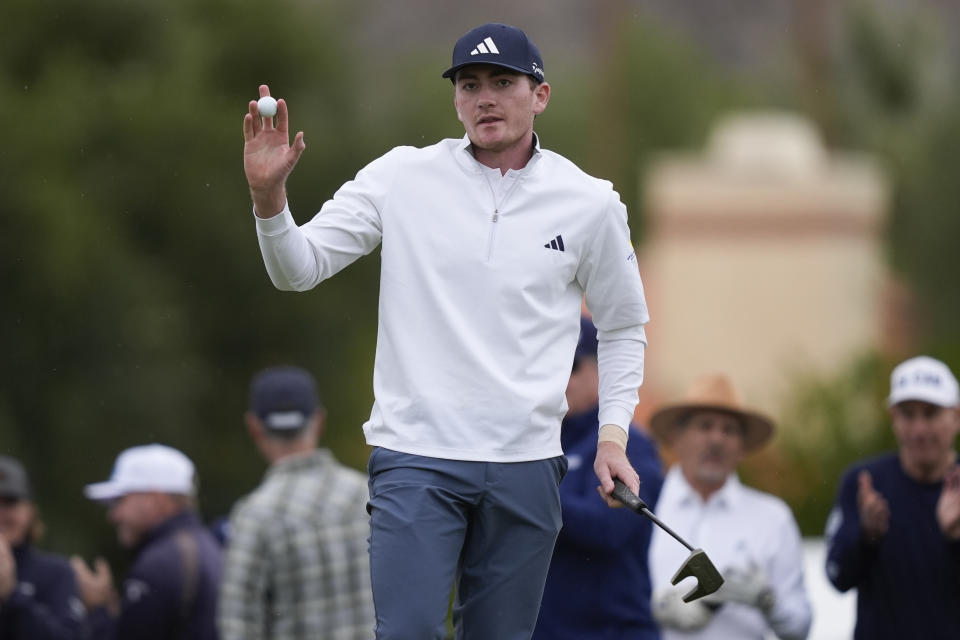 Nick Dunlap waves to the gallery on the ninth green at the La Quinta Country Club course during the third round of The American Express golf tournament Saturday, Jan. 20, 2024, in La Quinta, Calif. (AP Photo/Ryan Sun)