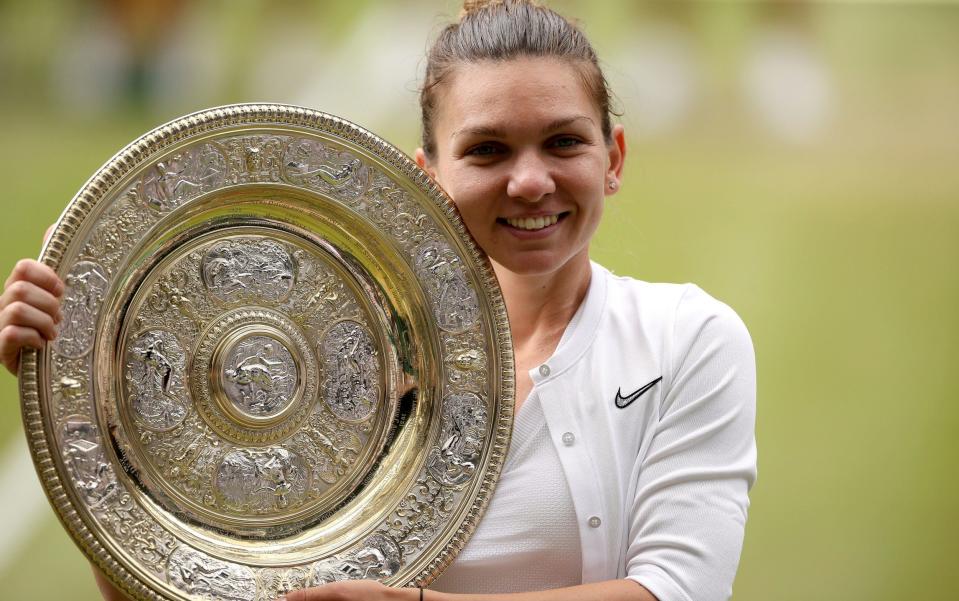 Simona Halep celebrates with the trophy after winning the women's singles final - PA/Steven Preston