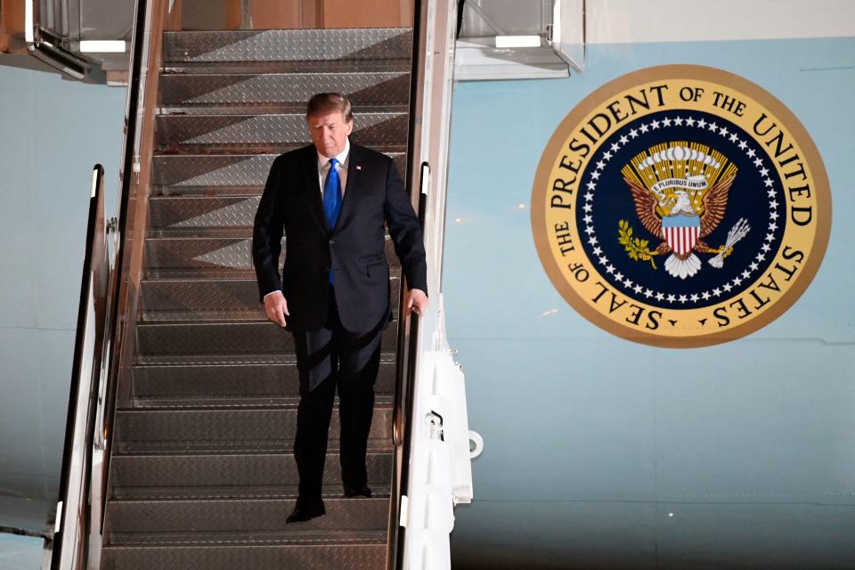 President Donald Trump walks off Air Force One at Noi Bai International Airport on arrival, in Hanoi, Vietnam, Feb. 26, 2019, ahead of his second summit with North Korea's Kim Jong Un.