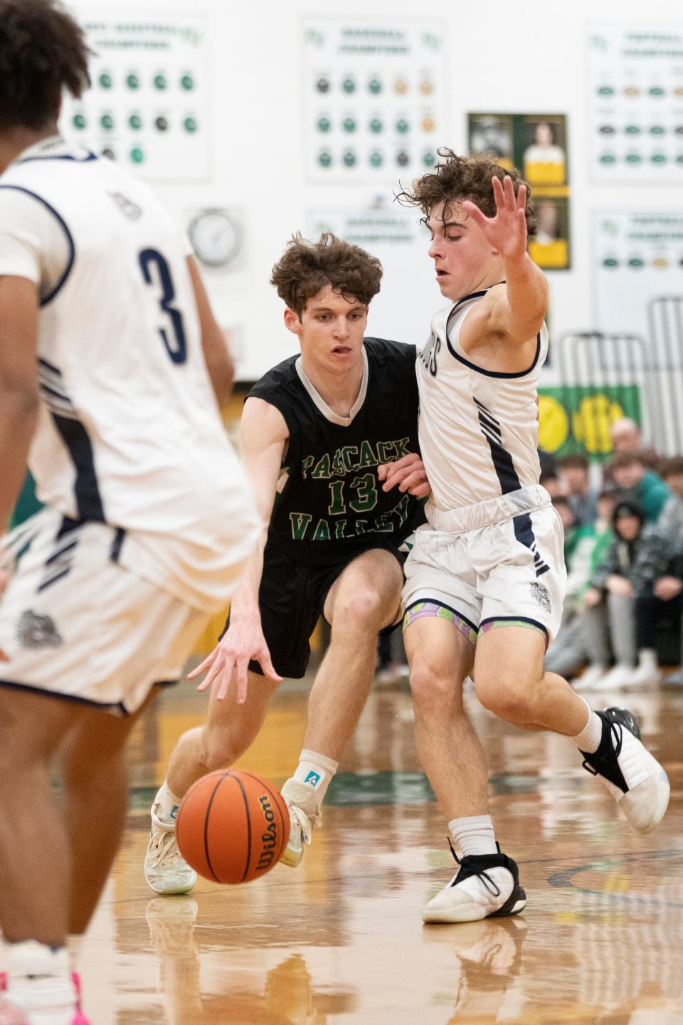 Jan 25, 2024; Hillsdale, New Jersey, United States; Rutherford boys basketball at Pascack Valley in the first round of the 67th Bergen County Jamboree. PV #13 Shane Buoye tries to get past R #1 Noah Pesantez.