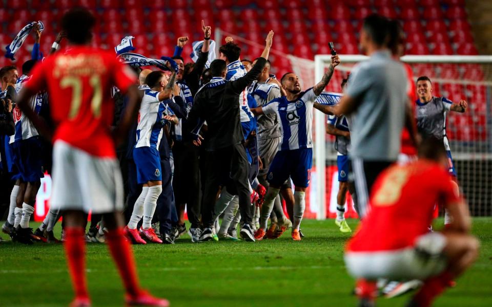 FC Porto's Brazilian defender Alex Telles (2R) celebrates with teammates after winning the 'Taca de Portugal' (Portugal's Cup) final football match between SL Benfica and FC Porto at the City Stadium of Coimbra on August 1, 2020 - AFP