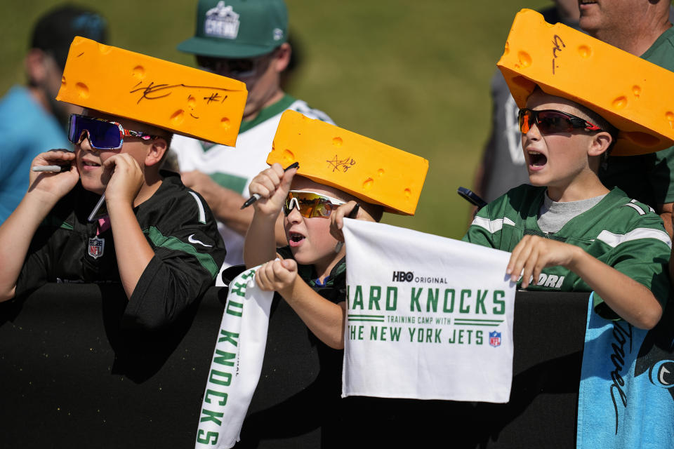 Fans seek autographs from players arriving for a joint NFL football camp with the Carolina Panthers and New York Jets, Wednesday, Aug. 9, 2023, in Spartanburg, S.C. (AP Photo/Mike Stewart)