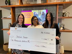 TruStone Financial presents a $1,000 check and food donations to Shalom Center. From left to right: Kacie Osten, SVP/Retail Banking; Tamarra Coleman, Executive Director of the Shalom Center; Tiffany Miceli, AVP/Branch Manager.