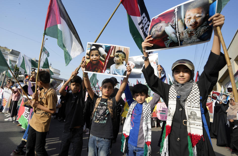 Supporters of the Palestine Foundation chant slogans during a demonstration against Israeli airstrikes on Gaza, and to show solidarity with Palestinian people, in Karachi, Pakistan, Saturday, Oct. 21, 2023. (AP Photo/Fareed Khan)