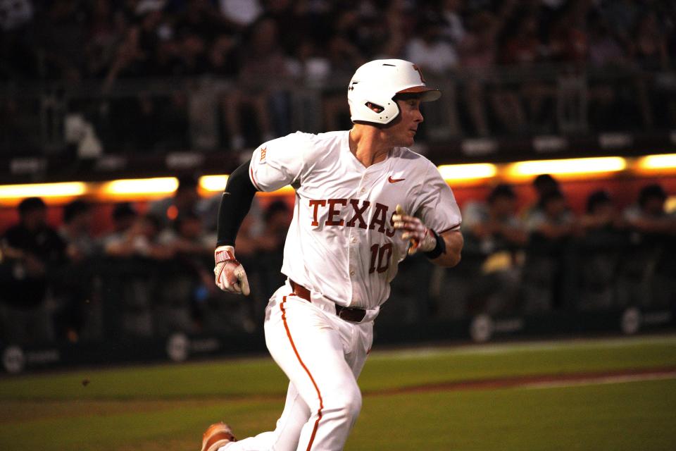 Texas Longhorns catcher Kimble Schuessler (10) hits against Texas A&M Aggies during the second round in the NCAA baseball College Station Regional at Olsen Field College Station.