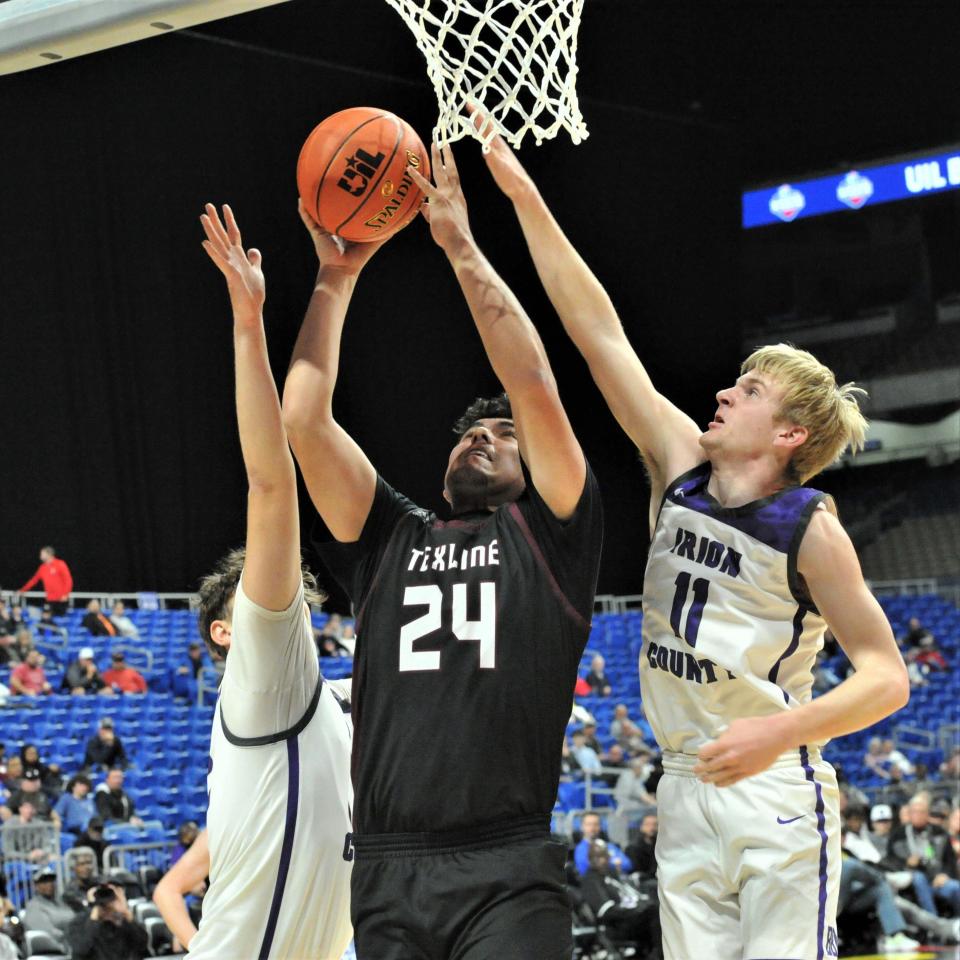 Texline's Noel Lozano reaches up for the basket against Irion County during the 2022 UIL Boys Basketball State Championship at the Alamodome in San Antonio on Thursday, March 10, 2022.