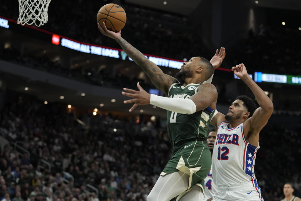 MILWAUKEE, WISCONSIN - OCTOBER 26: Damian Lillard #0 of the Milwaukee Bucks shoots the ball against Tobias Harris #12 of the Philadelphia 76ers in the first half at Fiserv Forum on October 26, 2023 in Milwaukee, Wisconsin. NOTE TO USER: User expressly acknowledges and agrees that, by downloading and or using this photograph, User is consenting to the terms and conditions of the Getty Images License Agreement. (Photo by Patrick McDermott/Getty Images)