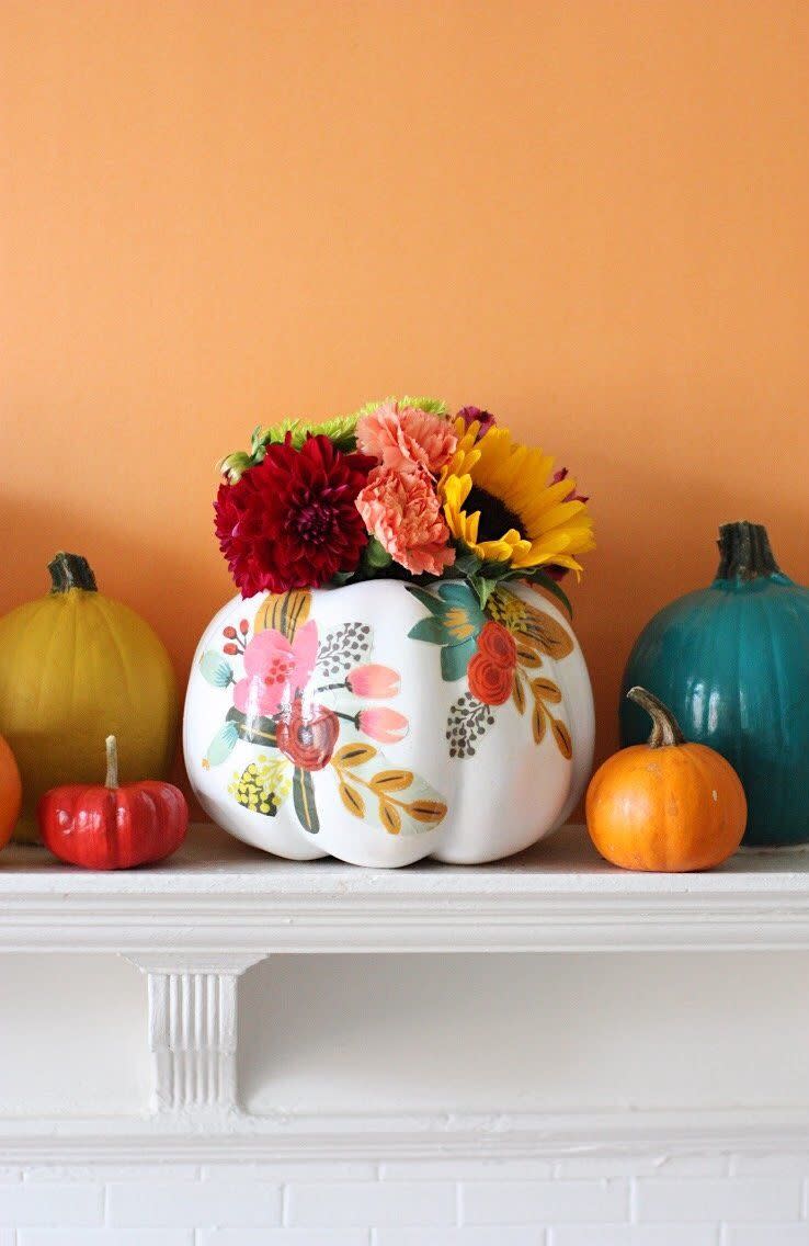 <p><span>Refuse to believe summer is actually over? Deck your pumpkins out in florals so you can keep up with the changing of the seasons but still represent the one you love the most.</span></p><p>Get the tutorial at <a href="https://prettylifegirls.com/2017/10/diy-floral-pumpkin-vases.html" rel="nofollow noopener" target="_blank" data-ylk="slk:The Pretty Life Girls;elm:context_link;itc:0;sec:content-canvas" class="link ">The Pretty Life Girls</a>. </p>