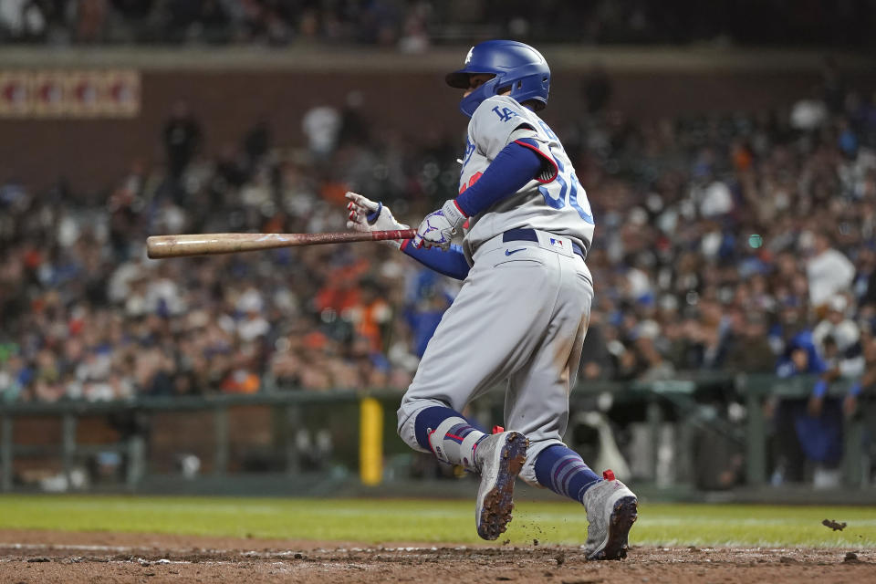 Los Angeles Dodgers' Mookie Betts watches his RBI double during the eighth inning of a baseball game against the San Francisco Giants in San Francisco, Tuesday, Aug. 2, 2022. (AP Photo/Jeff Chiu)