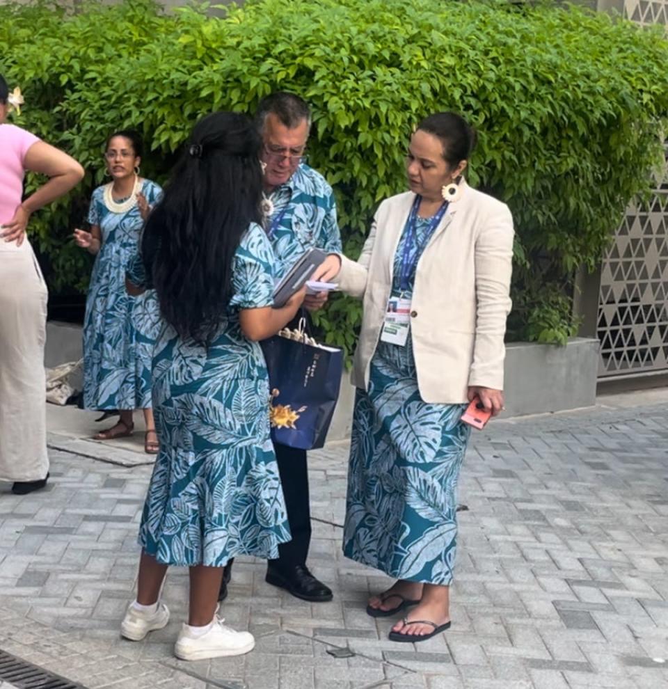 Tina Stege in discussion with members of the Marshall Islands team including Minister John M Silk, the head of delegation (Louise Boyle/The Independent)