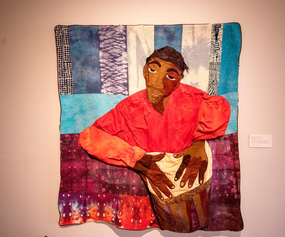 "He Drums Lubolo 2005," a quilt by Lauren Austin at the Polk Museum of Art. Austin's quilts are one of three temporary exhibits on display now at the museum.