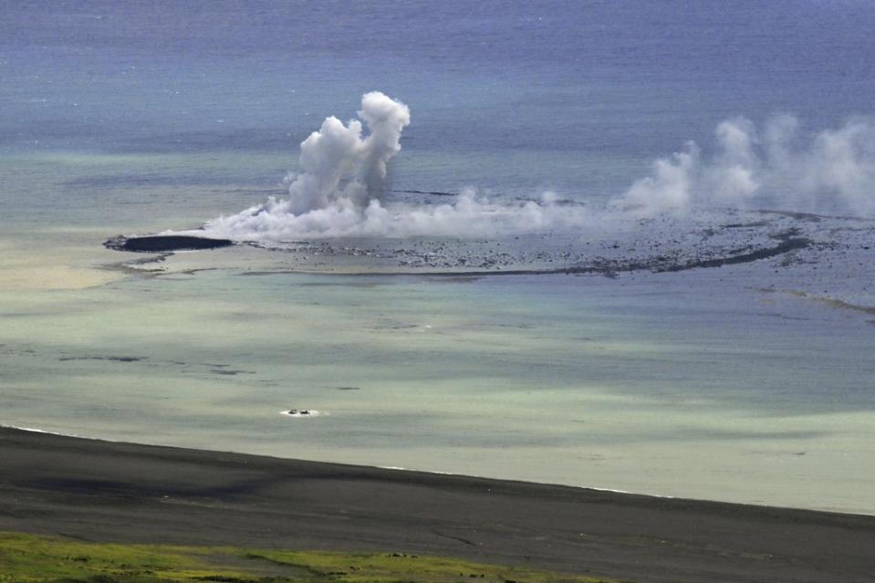 In this aerial photo, plume billows from the water off the Ioto island, following an eruption in Ogasawara, southern Tokyo, Japan, on Oct. 30, 2023. An unnamed undersea volcano, located about 1 kilometer (half a mile) off the southern coast of Iwo Jima, which Japan calls Ioto, started its latest series of eruptions on Oct. 21. (Kyodo News via AP)