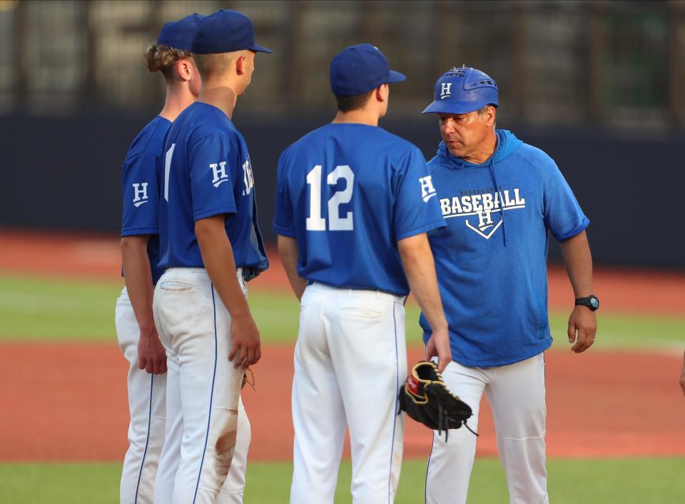Horseheads head coach Jeff Limoncelli meets with players at the mound in a 7-1 loss to Ketcham in a Class AA regional semifinal baseball game June 2, 2022 at Dutchess Stadium in Wappingers Falls.
