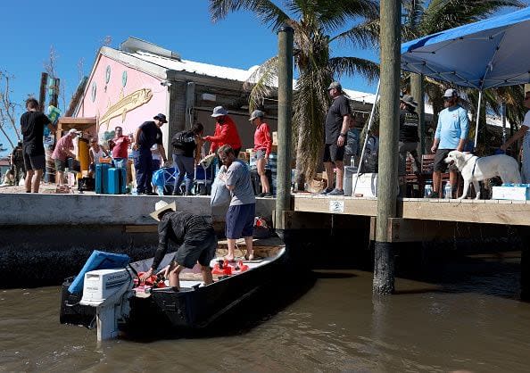 Residents are evacuated from the island by boats on October 2, 2022, in Pine Island, Florida. Residents are being encouraged to leave because the only road onto the island is impassable and electricity and water remain knocked out after Hurricane Ian passed through the area.