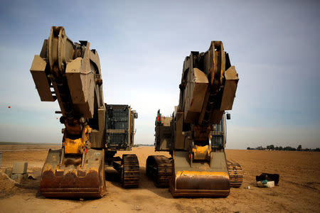 Diggers are seen near the area where the Israeli forces said a "significant" cross-border attack tunnel from the Gaza Strip, which was being dug by the enclave's dominant Islamist group, Hamas, was destroyed, near Israel's border with the Gaza Strip December 10, 2017. REUTERS/Amir Cohen