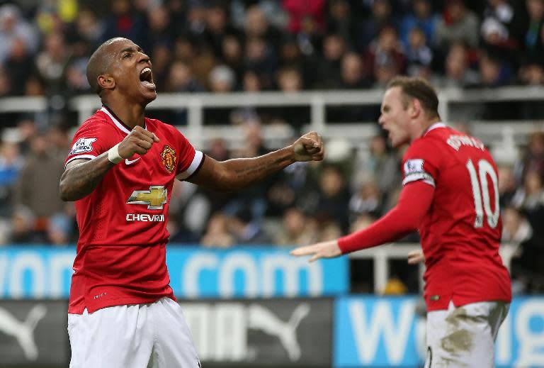 Manchester United's Ashley Young (L) celebrates scoring a goal during their English Premier League match against Newcastle, at St James Park in Newcastle-Upon-Tyne, north-east England, on March 4, 2015