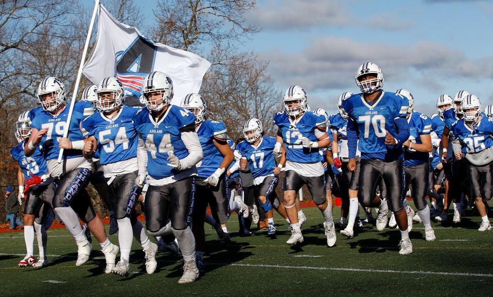 Ashland football team take the field during Thiursday’s 100th Thanksgiving Day meeting with Hopkinton at Ashland High.