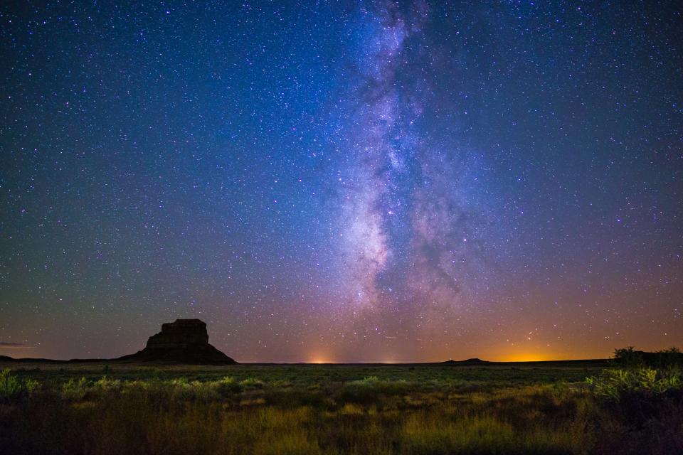 The Milky Way illuminates the sky above Fajada Butte at Chaco Culture National Historical Park in New Mexico.