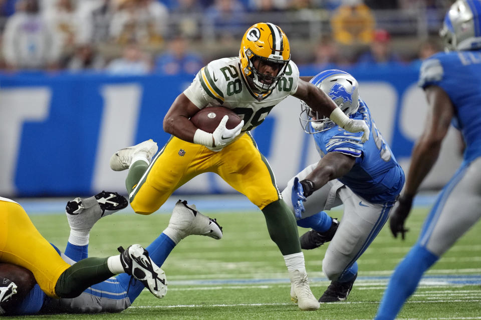 Green Bay Packers running back AJ Dillon (28) rushes during the second half of an NFL football game against the Detroit Lions, Sunday, Nov. 6, 2022, in Detroit. (AP Photo/Paul Sancya)