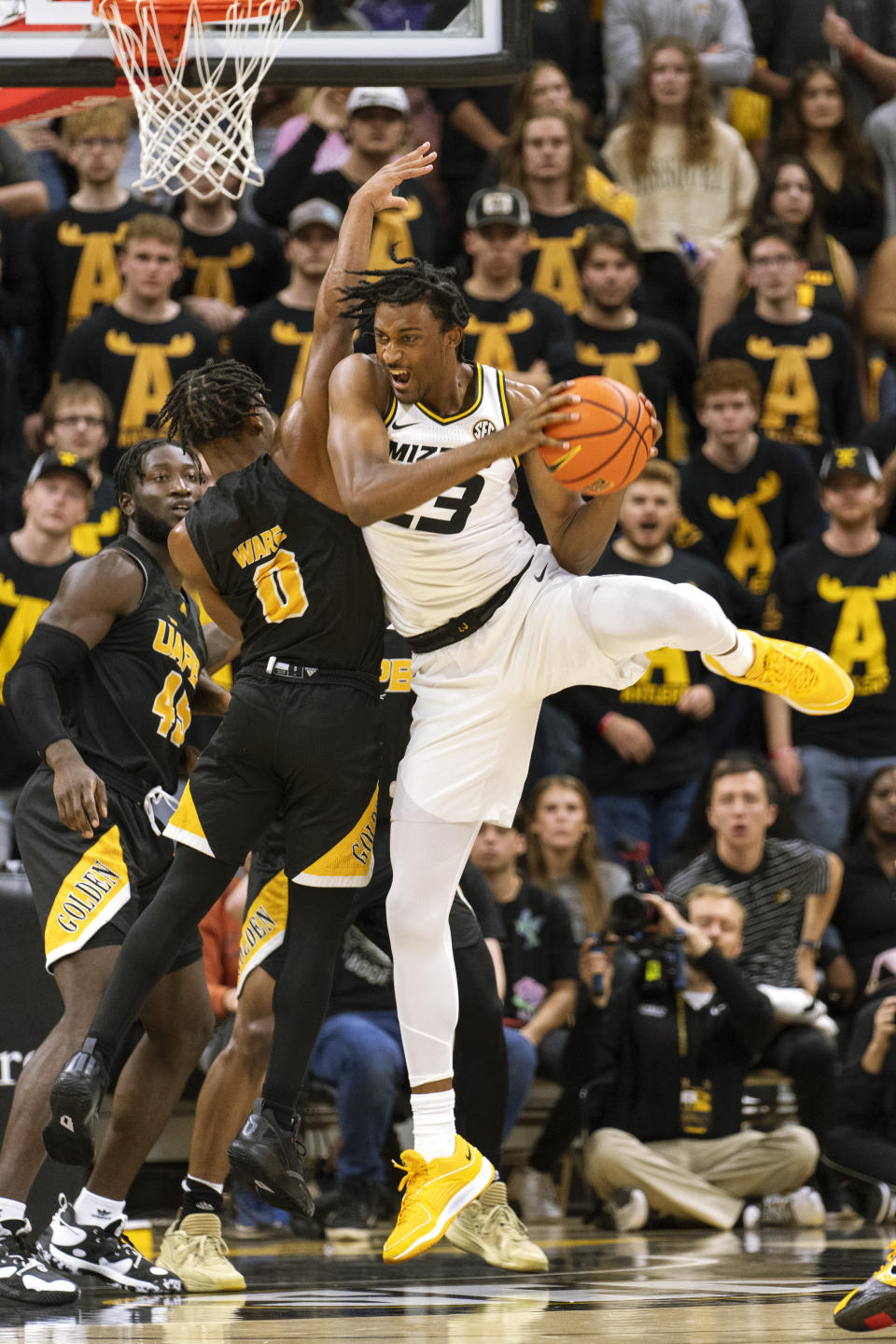 Missouri's Aidan Shaw, right, pulls down a rebound over Arkansas-Pine Bluff's Trejon Ware, left, during the first half of an NCAA college basketball game Monday, Nov. 6, 2023, in Columbia, Mo. (AP Photo/L.G. Patterson)