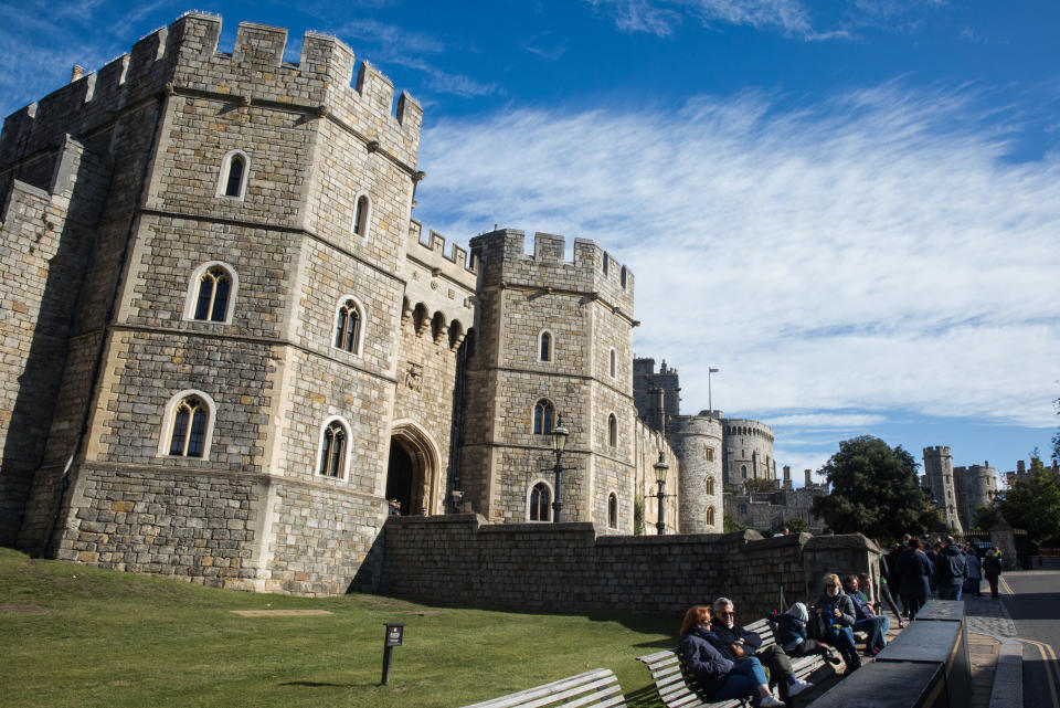 Tourists sit outside Windsor Castle where special precautions have been taken by the Royal Collection Trust to help protect visitors from the coronavirus on 26 September 2020 in Windsor, United Kingdom. The Royal Borough of Windsor and Maidenhead is aware of a rise in local coronavirus infections, has a COVID-19 outbreak management plan in place to try to ensure that the numbers do not increase further and has requested access to more coronavirus testing sites with this in mind. (photo by Mark Kerrison/In Pictures via Getty Images)